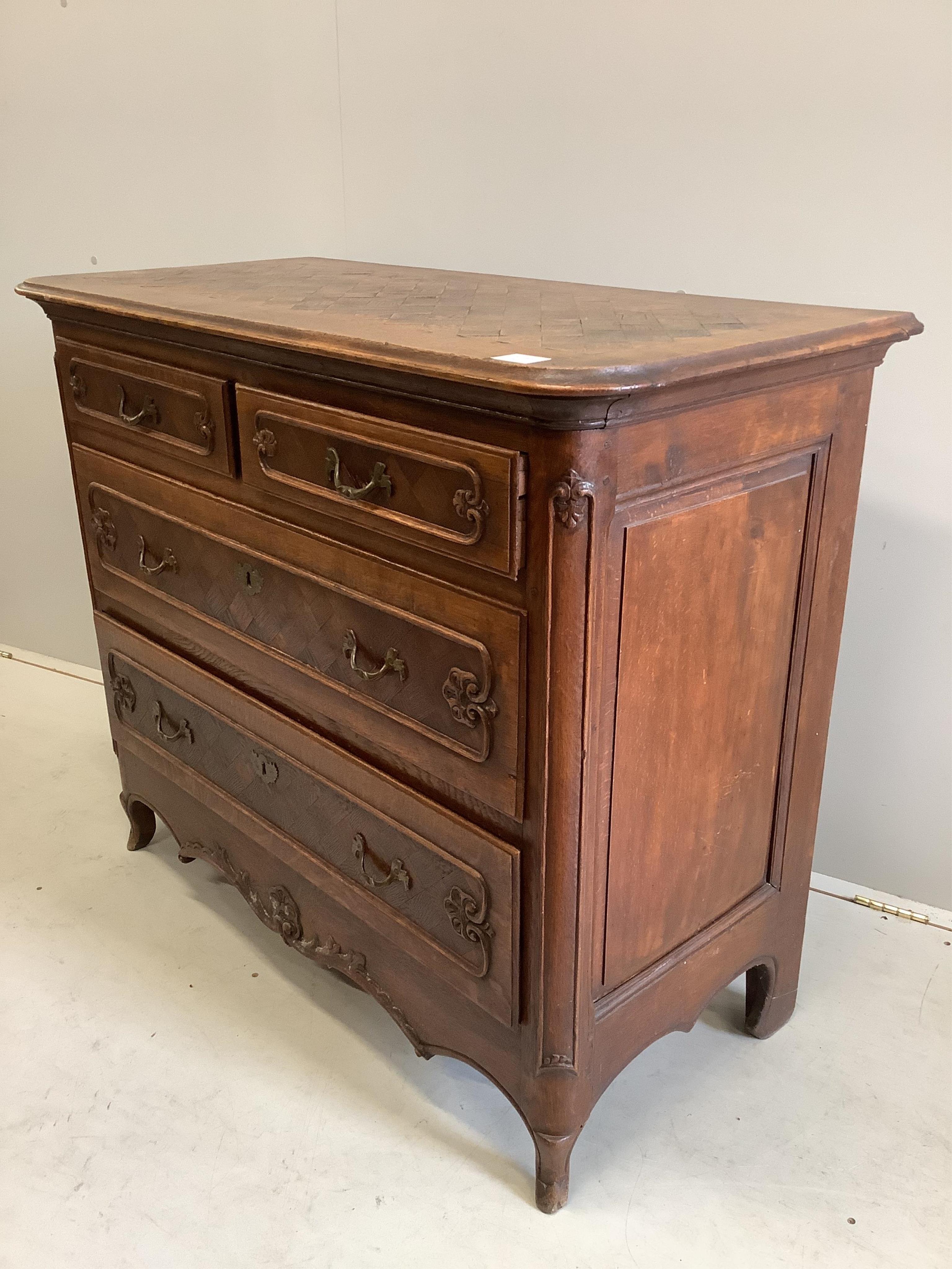 An early 18th century French oak and parquetry commode, width 110cm, depth 52cm, height 92cm